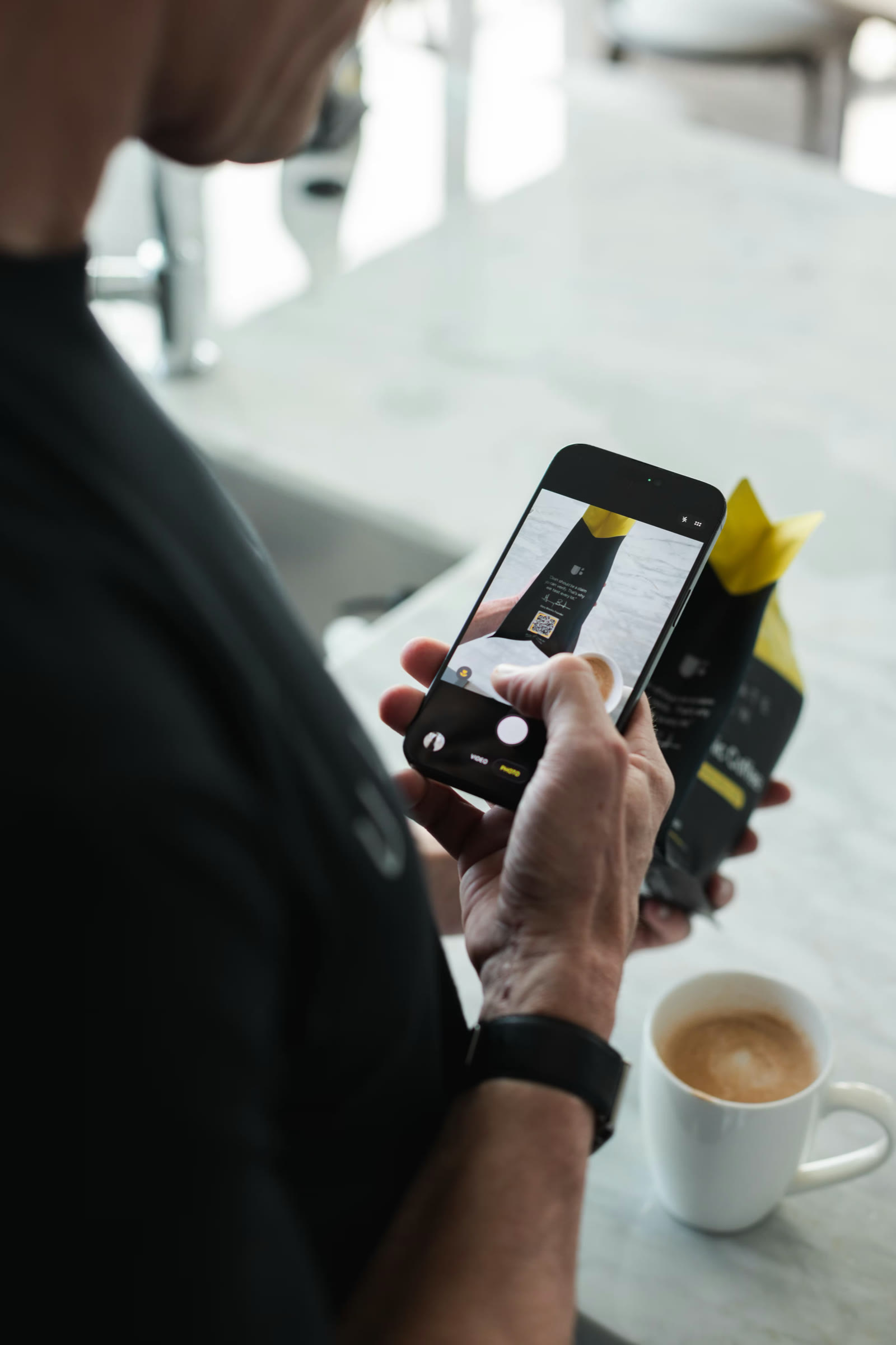 Scanning the QR code on an Ultimate Brew bag with a phone